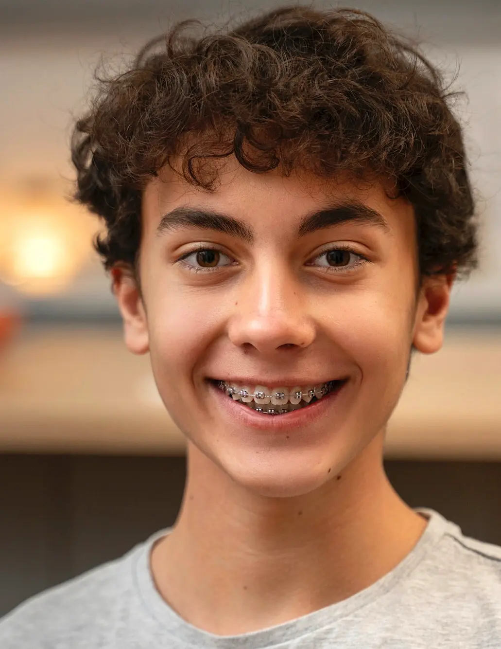 Teens boy smiling with braces