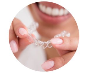 close up of smiling adult inserting clear aligner
