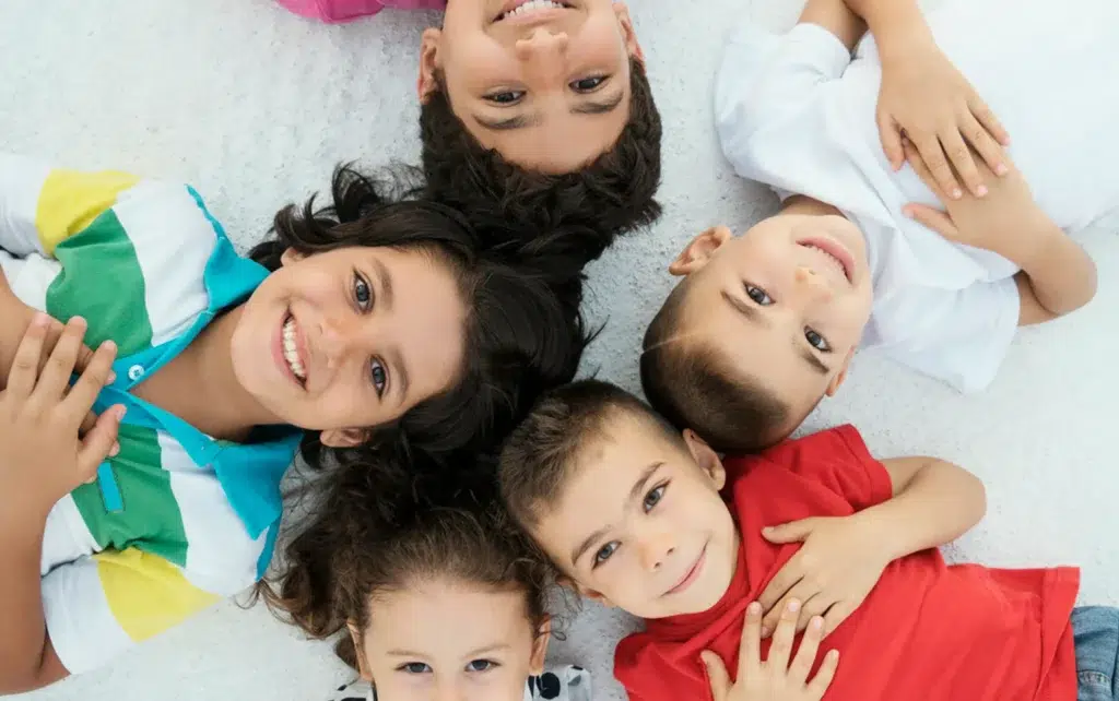 A group of happy kids on a floor